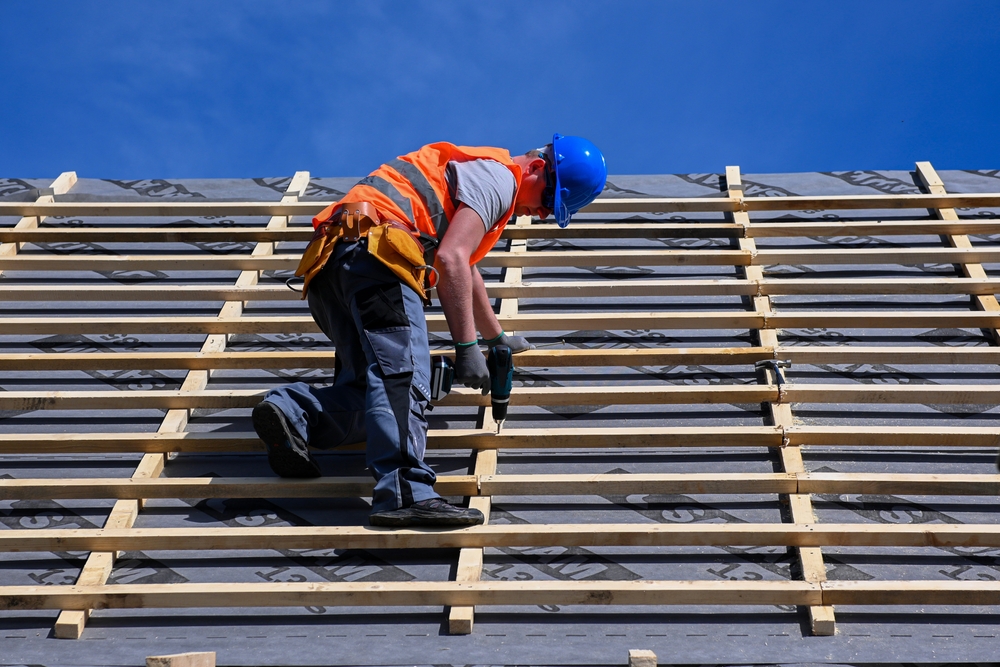 A professional roofer working on a roof.